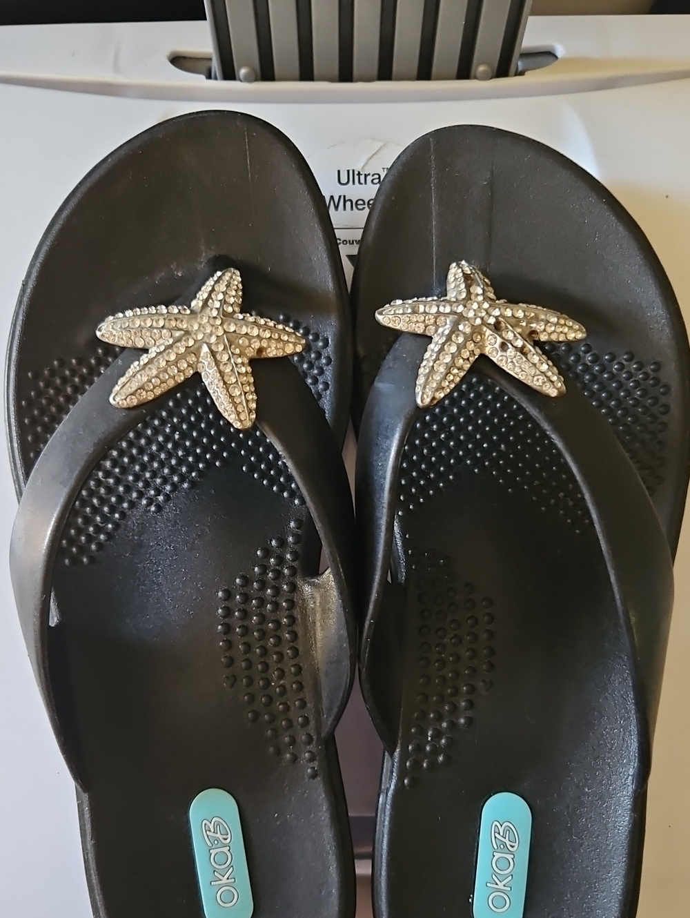 OKA b. Black Flip Flop Sandals with Gold Starfish Accents
